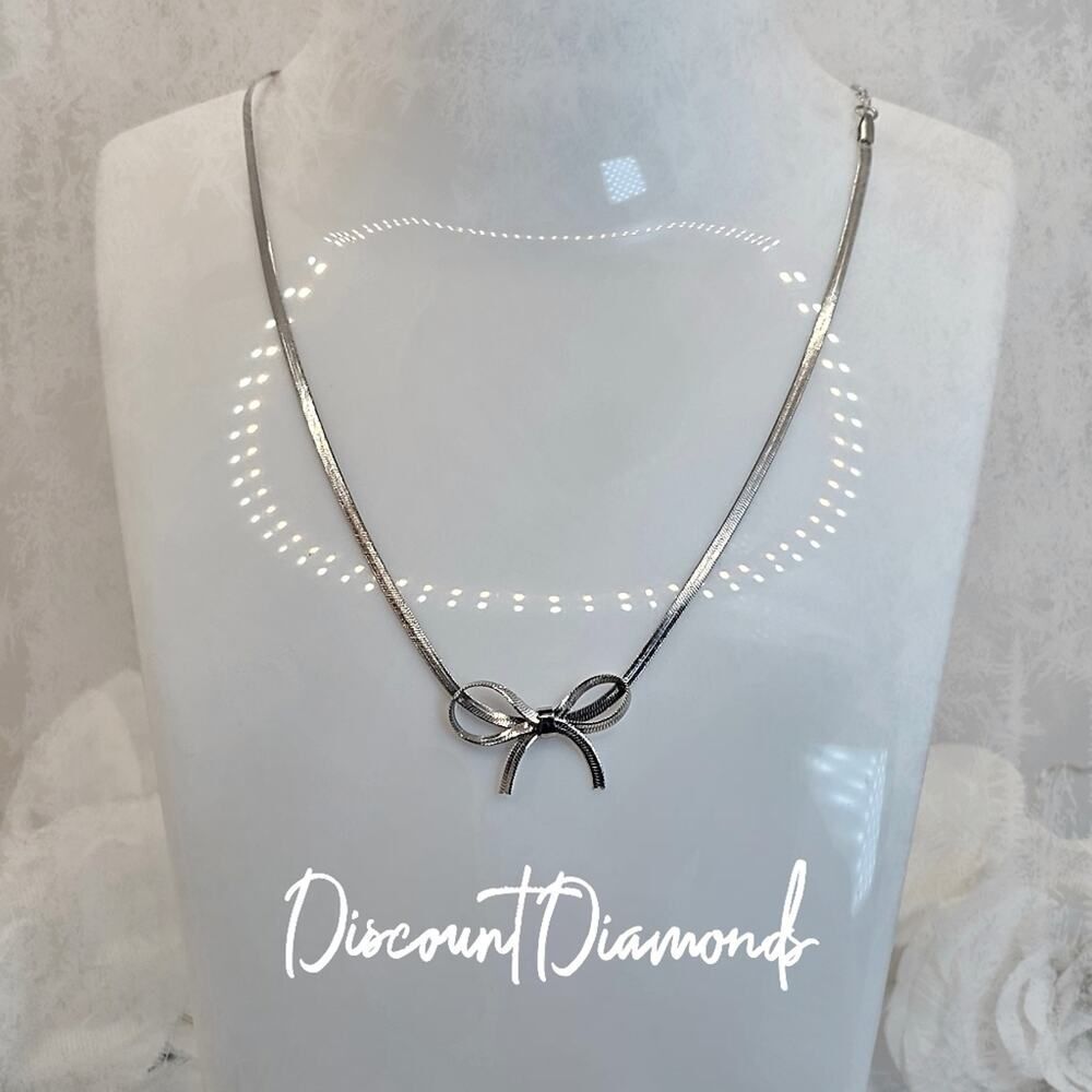 "Tied Up With A Bow" White Gold Necklace-18k Gold Over Titanium